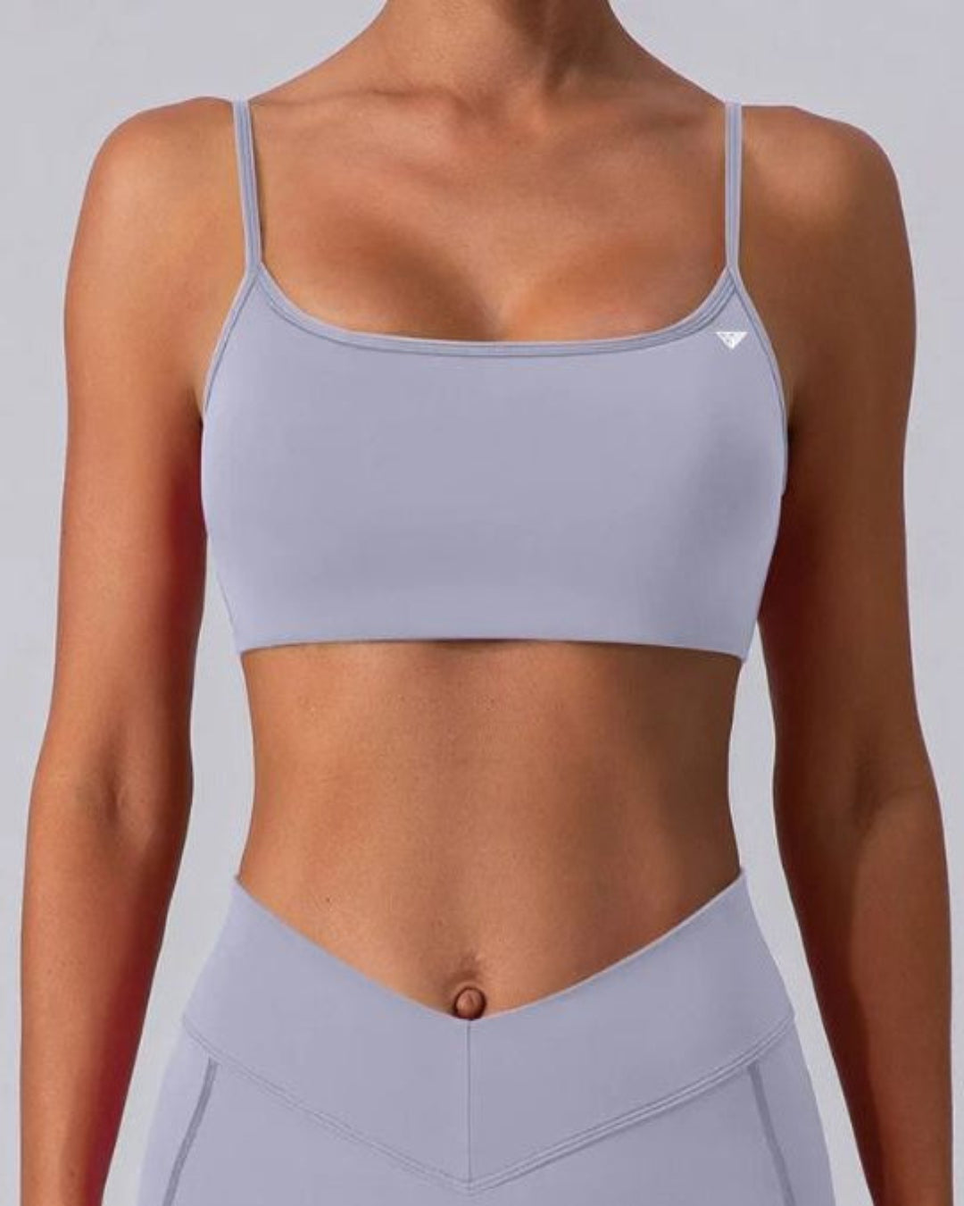 BD WEAR Mira crop top in black, fitted with short sleeves and a stylish neckline, displayed on a mannequin.