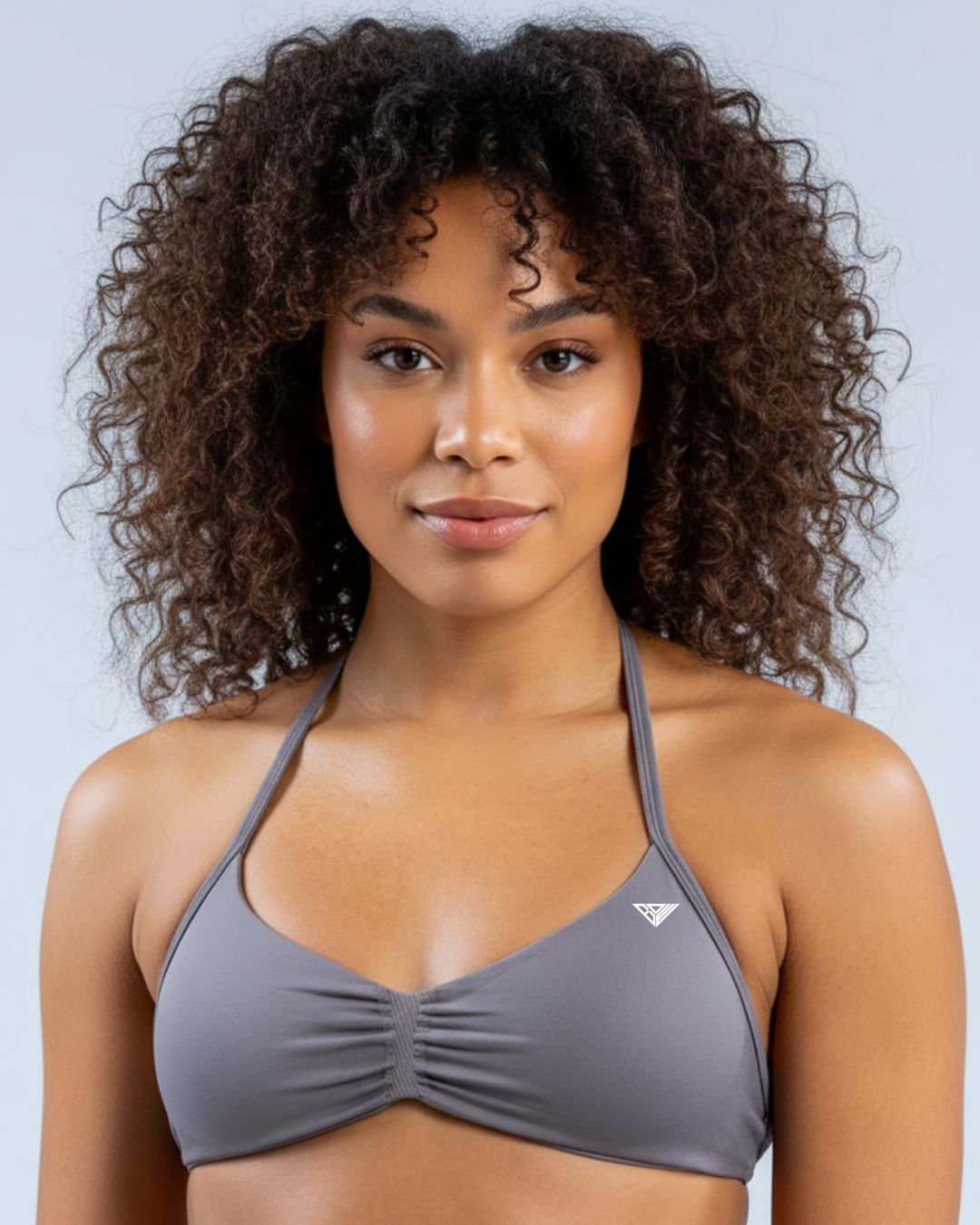BD WEAR Alia Halter Sports Bra in black, featuring supportive halter design and moisture-wicking fabric for active wear.