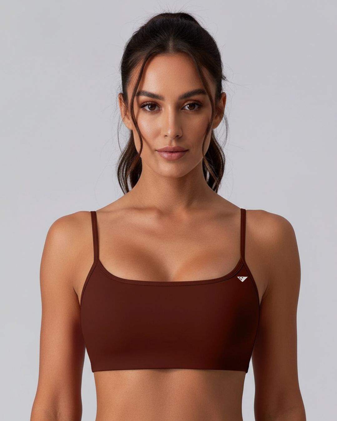 BD WEAR Mira crop top in black, featuring a fitted design and short sleeves, shown laid flat on a white background.