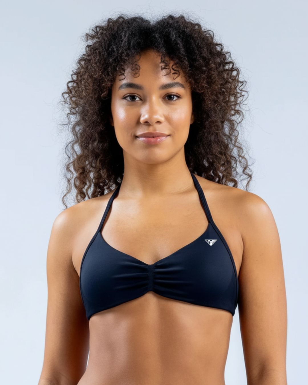 BD WEAR Alia halter sports bra featuring supportive design and breathable fabric, shown in black with adjustable straps.