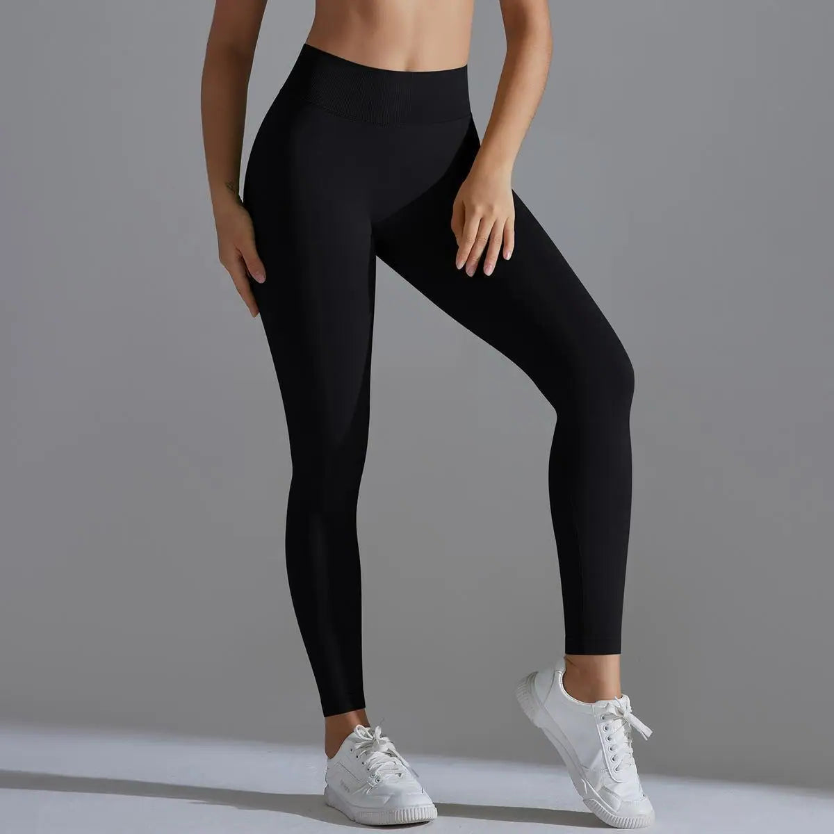 A pair of black Astra Sculpt Leggings by BD WEAR, high-waisted with a stretchy, form-fitting design for active wear or casual outfits.