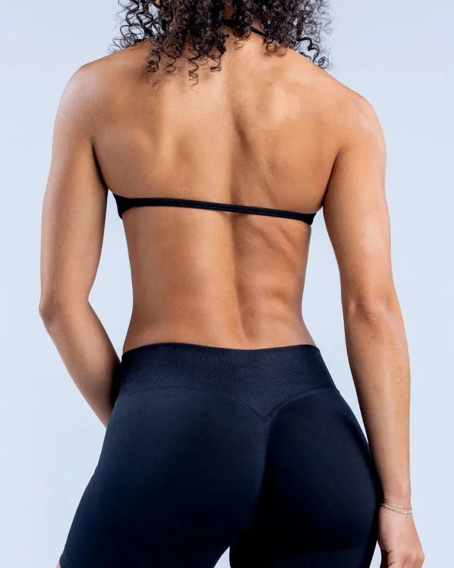BD WEAR Alia Halter Sports Bra in black with supportive halter design and moisture-wicking fabric, front view.