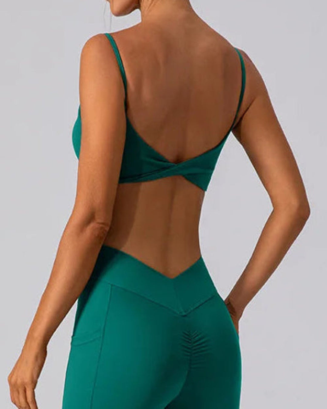 BD WEAR Mira crop top in black, close-up showing fitted style and soft fabric with a round neckline.